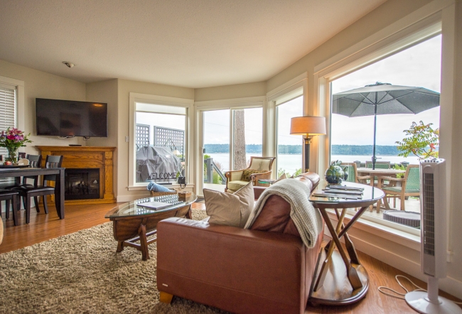 cliff house north living room with ocean view and fireplace